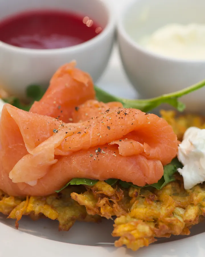 Crisp potato rosti topped with smoked salmon and chevin, with sweet chilli on the side