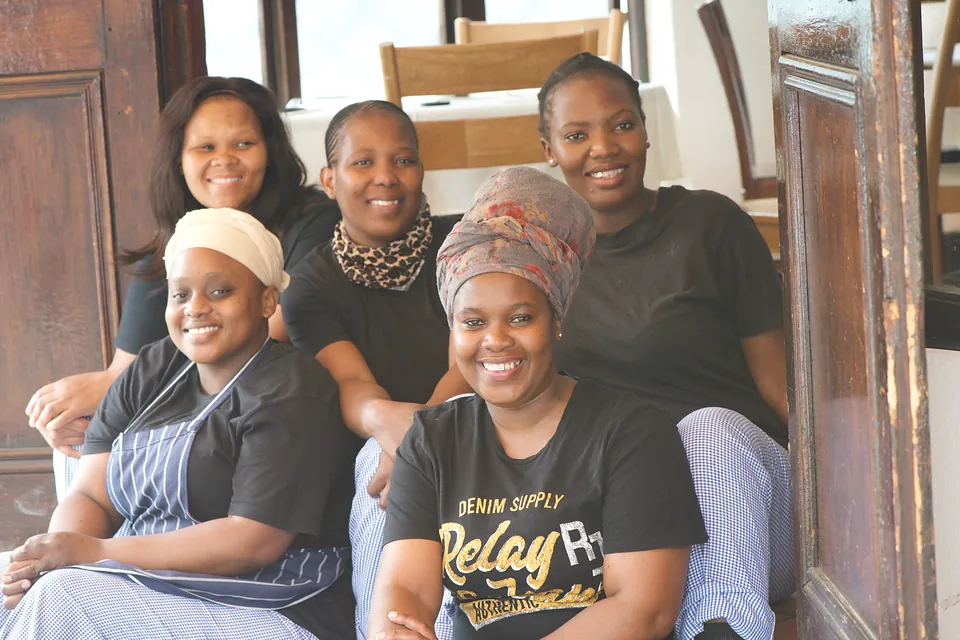 Members of the Bellinis team, smiling together in the restaurant